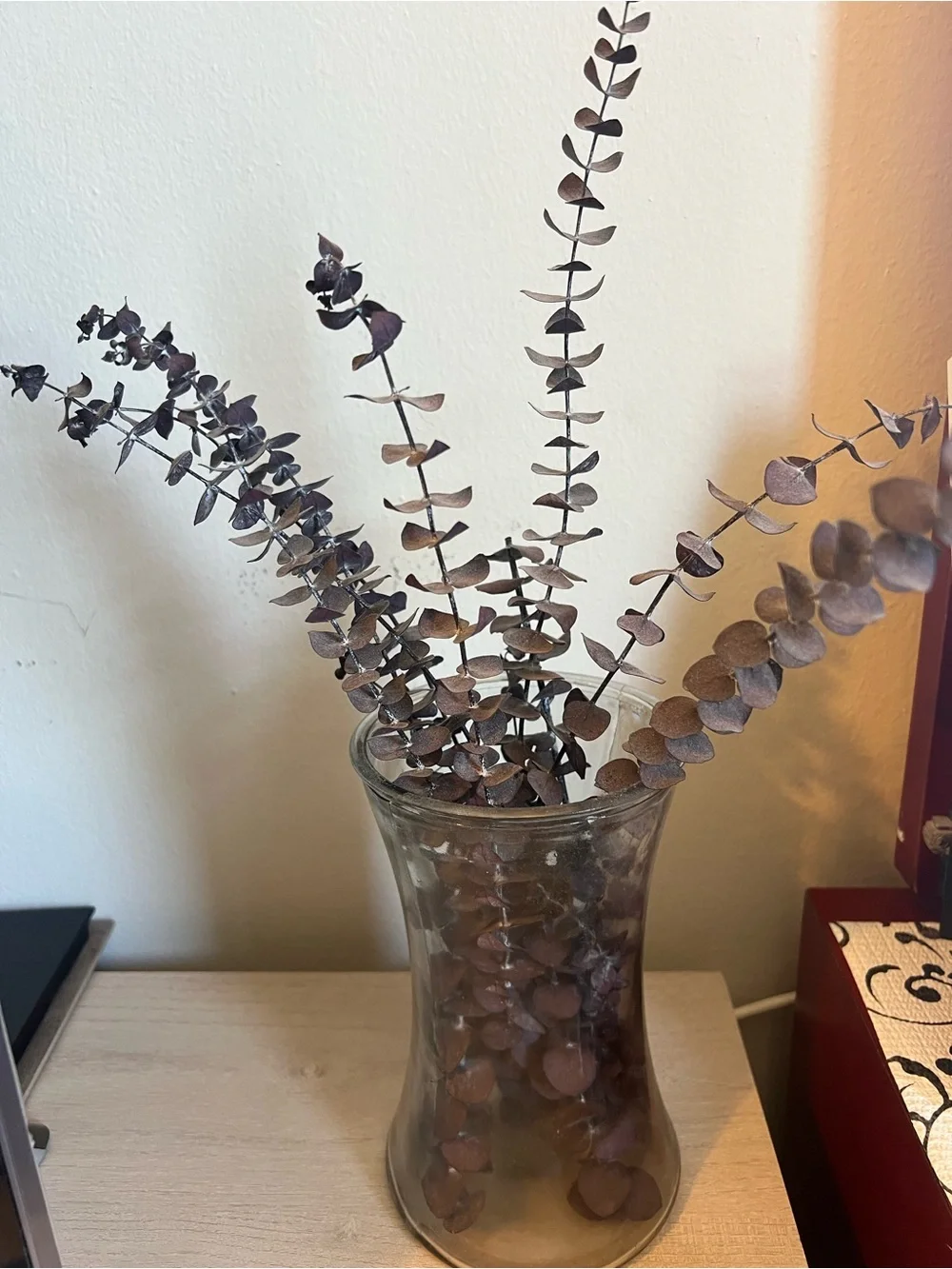 Dried Eucalyptus Stem Arrangement in Brown Glass Vase